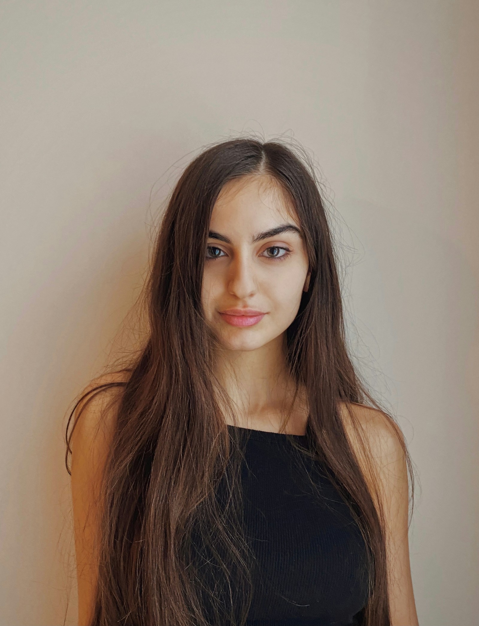 Long, straight brunette hair with a glossy finish